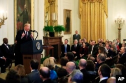 President Donald Trump speaks during a presentation ceremony of the Presidential Medal of Freedom in the East Room of the White House, in Washington, Friday, Nov. 16, 2018. Attending the ceremony are U.S. Supreme Curt Justices, back left to right, Brett Kavanaugh, Neil Gorsuch, Elena Kagan, Ruth Bader Ginsburg and Chief Justice John Roberts.