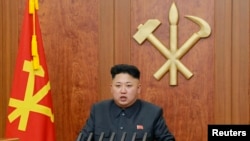 North Korean leader Kim Jong Un delivers a speech during his New Year address, released by Kyodo Jan. 1, 2014.