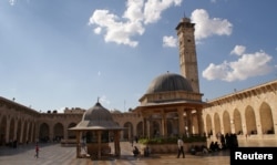 Visitors walk inside Aleppo's Umayyad mosque, Syria Oct. 6, 2010.