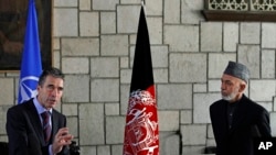 NATO Secretary-General Anders Fogh Rasmussen (l) during a joint press conference with Afghan President Hamid Karzai at the presidential palace in Kabul, March, 4, 2013. 