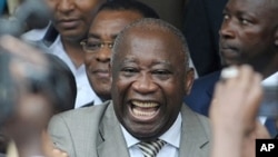 Ivory Coast President Laurent Gbagbo (center) with supporters in Abidjan after he submitted his candidacy for presidential election, 16 October 2009