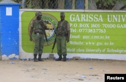 FILE - Kenya Administration policemen stand in front of Garissa University College in Garissa, April 4, 2015.