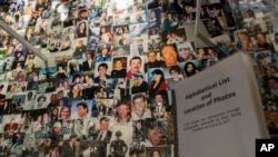 Photographs of some of those who died during the terrorist attacks on the World Trade Center, the Pentagon, and Shanksville, Pa., are on display at the 9/11 Tribute Museum in New York, June 8, 2017.