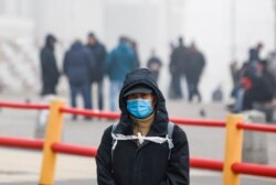 A man wearing a face mask is seen in Komsomolskaya Square amid the COVID-19 outbreak, in Moscow, Russia, Nov. 2, 2021.