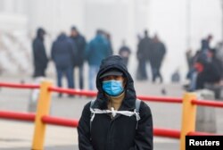 A man wearing a face mask is seen in Komsomolskaya Square amid the COVID-19 outbreak, in Moscow, Russia, Nov. 2, 2021.