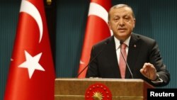 Turkish President Tayyip Erdogan speaks during a news conference following the National Security Council and cabinet meetings at the Presidential Palace in Ankara, July 20, 2016. 