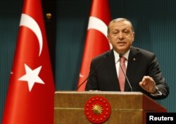 Turkish President Tayyip Erdogan speaks during a news conference following the National Security Council and cabinet meetings at the Presidential Palace in Ankara, July 20, 2016.