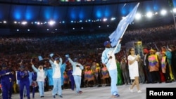 Flag-bearer Mohamed Daud Mohamed of Somalia leads his contingent during the opening ceremony at the 2016 Rio Olympics in Rio de Janeiro, Brazil, Aug. 5, 2016.