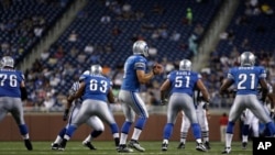 FILE - Detroit Lions quarterback Matthew Stafford drops back to pass against the Indianapolis Colts during the second quarter of a exhibition NFL football game at Ford Field in Detroit.