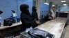 Afghan women airport workers are pictured at a security checkpoint in the airport in Kabul on Sept. 12, 2021.