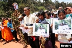 FILE - People march to the killing site of Cambodian anti-logging activist Chut Wutty in Koh Kong province, May 11, 2012.