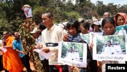 FILE - People march to the killing site of Cambodian anti-logging activist Chut Wutty in Koh Kong province, May 11, 2012.