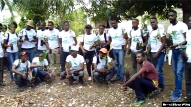 Members of Rotaract Club hold prepare to plant trees in Beret, Haiti for World Environment Day.