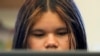 Alisson Ramírez uses a laptop to work on an assignment during science class Wednesday, Aug. 28, 2024, in Aurora, Colorado. (AP Photo/Godofredo A. Vásquez)