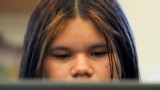 Alisson Ramírez uses a laptop to work on an assignment during science class Wednesday, Aug. 28, 2024, in Aurora, Colorado. (AP Photo/Godofredo A. Vásquez)