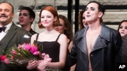 Emma Stone and Alan Cumming appear at the curtain call following Stone's debut performance in Broadway's "Cabaret," Nov. 11, 2014 in New York. 