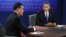 President Barack Obama listens as Republican presidential nominee Mitt Romney speaks during the third presidential debate at Lynn University, in Boca Raton, Florida, October 22, 2012. 