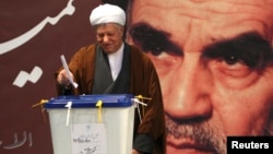 Former Iranian president Ali Akbar Hashemi Rafsanjani is seen casting his ballot in parliamentary elections in Tehran in this March 2, 2012, file photo.