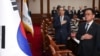 Acting South Korean President and Prime Minister Han Duck-soo salutes to a national flag during a cabinet meeting at the government complex in Seoul, Dec. 14, 2024. (Yonhap via Reuters)