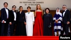 Sahra Mani and Jennifer Lawrence and the team of the documentary film "Bread and Roses" pose during the 76th Cannes Film Festival, Cannes, France, May 21, 2023.