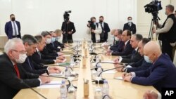 FILE - In this Oct. 12, 2020, file photo released by Russian Foreign Ministry Press Service, Russian Foreign Minister Sergey Lavrov, third from left, meets with Armenia's Foreign Minister Zohrab Mnatsakanyan in Moscow, Russia.