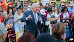 House Minority Whip Steny Hoyer, D-Md., center, speaks to immigrant rights supporters at the U.S. Capitol in Washington, Sept. 26, 2017. The groups and allies are advocating that Congress pass a clean Dream Act that will prevent the deportation of Dreamers working and studying in the U.S., and reform legalization of those with Temporary Protected Status who came to the U.S. fleeing natural disasters or civil wars.