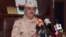 FILE - Ex-general Khalifa Haftar speaks during a news conference after surviving an assassination attempt in Al Marj, east of Benghazi, Libya, June 4, 2014. 