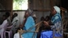 Villagers attend morning church service in the village of Kogelo in Siaya county, Kenya, July 26, 2015. Broadcasting in the Luo language, Dada Radio broadcasts on important issues for women and offers training. 