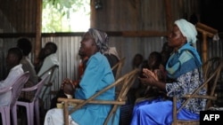 Villagers attend morning church service in the village of Kogelo in Siaya county, Kenya, July 26, 2015. Broadcasting in the Luo language, Dada Radio broadcasts on important issues for women and offers training. 