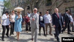 Britain's Prince Charles and Camilla, Duchess of Cornwall are seen during a guided tour of Old Havana in Havana, Cuba, March 25, 2019. 