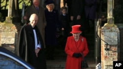 Britain's Queen Elizabeth II waits for her car after attending a Christmas day service at the St Mary Magdalene Church in Sandringham in Norfolk, England, Dec. 25, 2019.