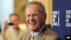 FILE - Actor Tab Hunter arrives at the Hollywood Foreign Press Association Luncheon in Beverly Hills, California, Aug. 13, 2013.
