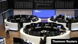 FILE - The German share price index DAX graph is pictured at the stock exchange in Frankfurt, Germany, Dec. 16, 2020.