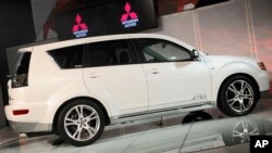 In an April 9, 2009 photo, the Mitsubishi Outlander GT is introduced at the 2009 New York International Auto Show. Mitsubishi is recalling two SUV models to fix problems that could cause the windshield wipers to malfunction.