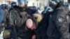 Police detain a man during a protest against the jailing of opposition leader Alexei Navalny in Khabarovsk, 6,100 kilometers east of Moscow, Russia, Jan. 23, 2021.