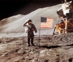 FILE - In this July 30, 1971 NASA photo, Apollo 15 Lunar Module Pilot James B. Irwin salutes while standing beside the fourth American flag planted on the moon.
