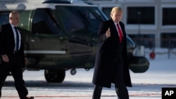 President Donald Trump gestures as he arrives in Davos, Switzerland on Marine One, Jan. 21, 2020. 
