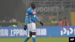 Napoli's Kalidou Koulibaly leaves the pitch after receiving a red card from the referee during a Serie A soccer match between Inter Milan and Napoli, at the San Siro stadium in Milan, Italy, Dec. 26, 2018. 