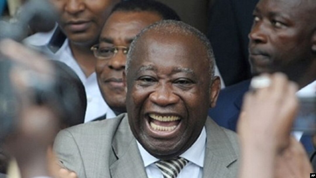 Ivory Coast President Laurent Gbagbo (center) with supporters in Abidjan after he submitted his candidacy for presidential election, 16 October 2009