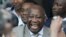 Ivory Coast President Laurent Gbagbo (center) with supporters in Abidjan after he submitted his candidacy for presidential election, 16 October 2009