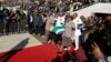 The casket carrying the remains of struggle icon Winnie Madikizela-Mandela arrives at the Orlando Stadium in Soweto, South Africa, Saturday, April 14, 2018. Madikizela-Mandela died on April 2 at the age of 81.