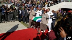 The casket carrying the remains of struggle icon Winnie Madikizela-Mandela arrives at the Orlando Stadium in Soweto, South Africa, Saturday, April 14, 2018. Madikizela-Mandela died on April 2 at the age of 81.