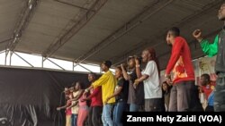 Des artistes congolais, rwandais et burundais en pleine répétition de l'hymne dit de fraternité, pour le festival Amani, un festival dédié à la paix dans la région. Goma, 3 février 2022.