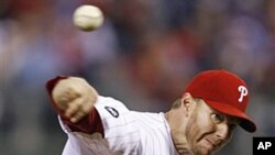 Philadelphia Phillies starting pitcher Roy Halladay delivers to a Cincinnati Reds batter during the fifth inning of Game 1 of baseball's National League Division Series, Wednesday, 06 Oct 2010