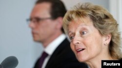 Swiss Finance Minister Eveline Widmer-Schlumpf (R) speaks to media next to European Commissioner for Taxation and Customs Union, Audit and Anti-Fraud Algirdas Semeta during a news conference in Bern, June 17, 2013.