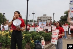 FILE - West Virginia University senior Mai-lyn Sadler leads a protest in the university's free speech zone outside the Mountainlair student union against cuts to programs in Morgantown, W.Va., on Monday, Aug. 21, 2023. (AP Photo/Leah Willingham)