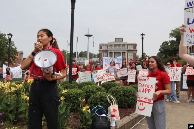 FILE - West Virginia University senior Mai-lyn Sadler leads a protest in the university's free speech zone outside the Mountainlair student union against cuts to programs in Morgantown, W.Va., on Monday, Aug. 21, 2023. (AP Photo/Leah Willingham)