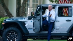 President Joe Biden gets out of a Jeep Wrangler Rubicon 4xE on the South Lawn of the White House in Washington, Aug. 5, 2021.
