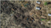 This file aerial view taken on November 21, 2020 shows a cemetery where alleged victims of the November 9, 2020 massacre were buried in collective graves, in Mai Kadra, Ethiopia.