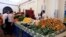 FILE: People buy vegetables on the first day of the Muslim holy fasting month of Ramadan at a market in Tunis, Tunisia,. Taken 5.27.2022